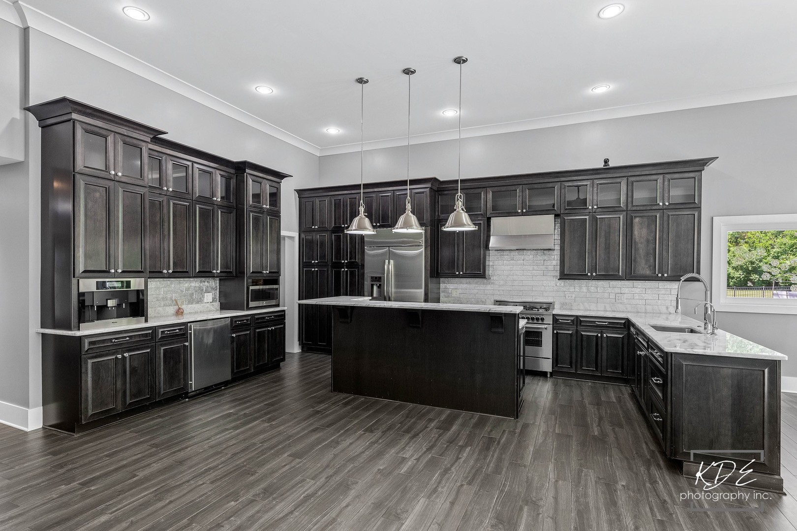 27W320 80th Street Naperville, IL 60565 - Photo 8 of 37 a kitchen with stainless steel appliances kitchen island granite countertop a stove a sink and a refrigerator