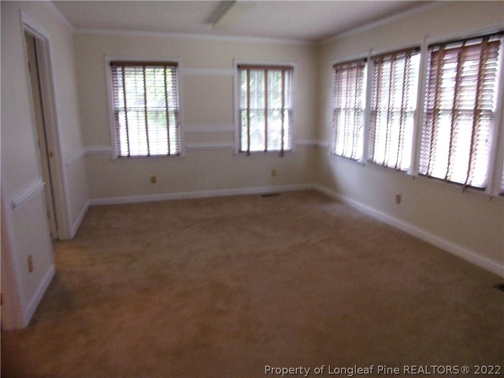 1503 Fairview Street Dunn, NC 28334 - Photo 7 of 10 an empty room with windows