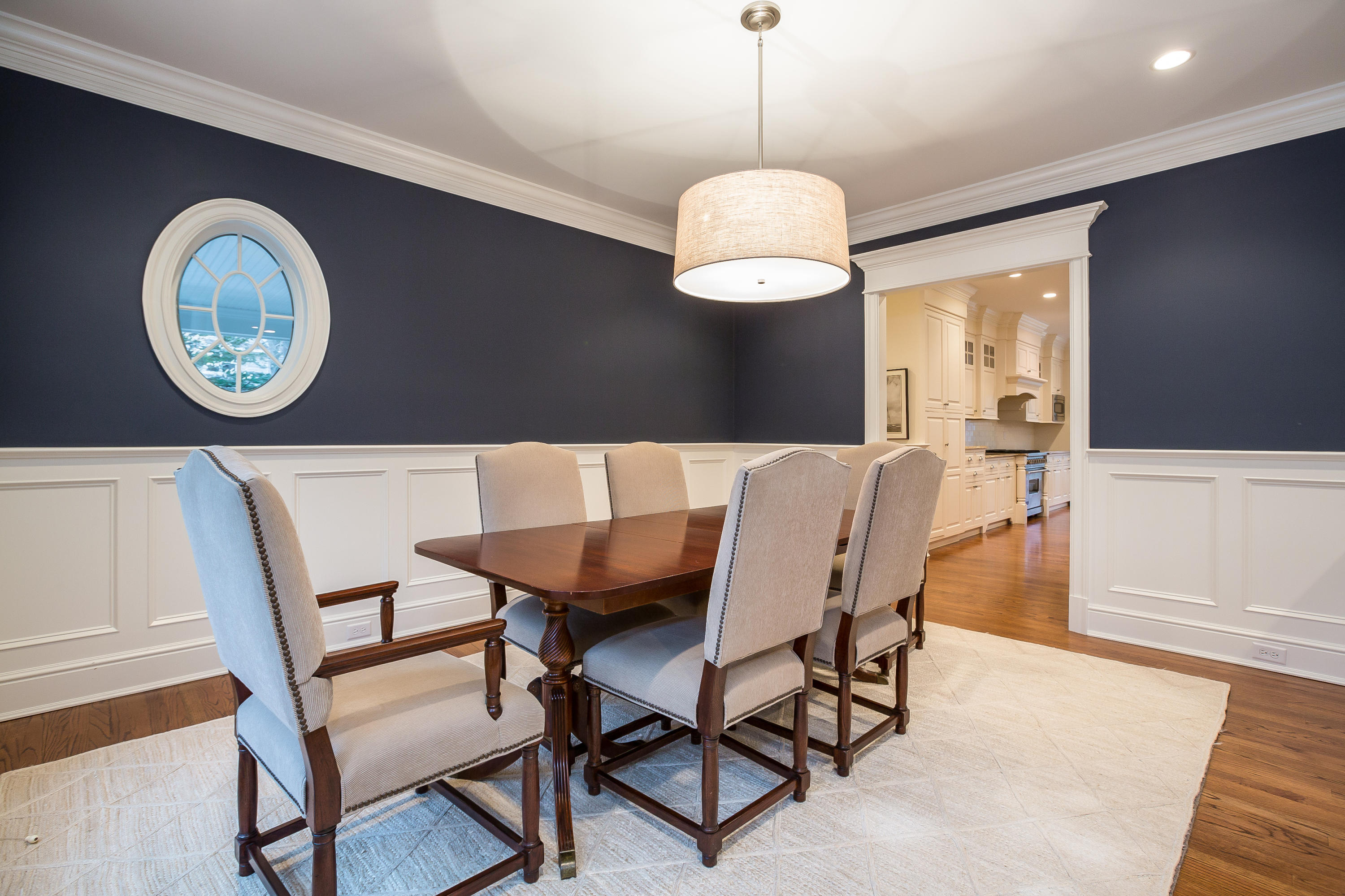 305 Middlesex Road Darien, CT 06820 - Photo 12 of 35 a view of a dining room with furniture chandelier and wooden floor