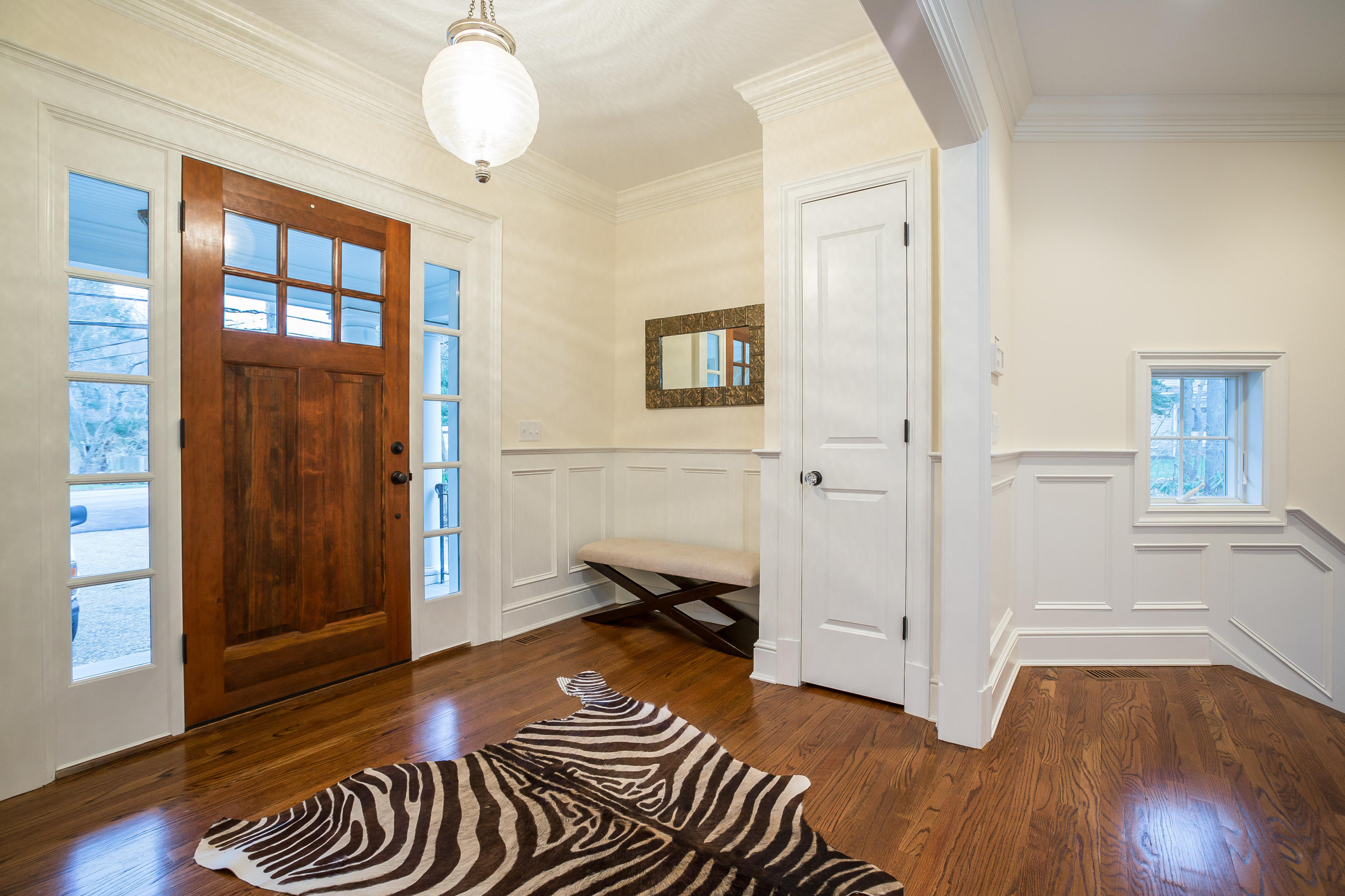 305 Middlesex Road Darien, CT 06820 - Photo 15 of 35 a bedroom with a bed and wooden floor