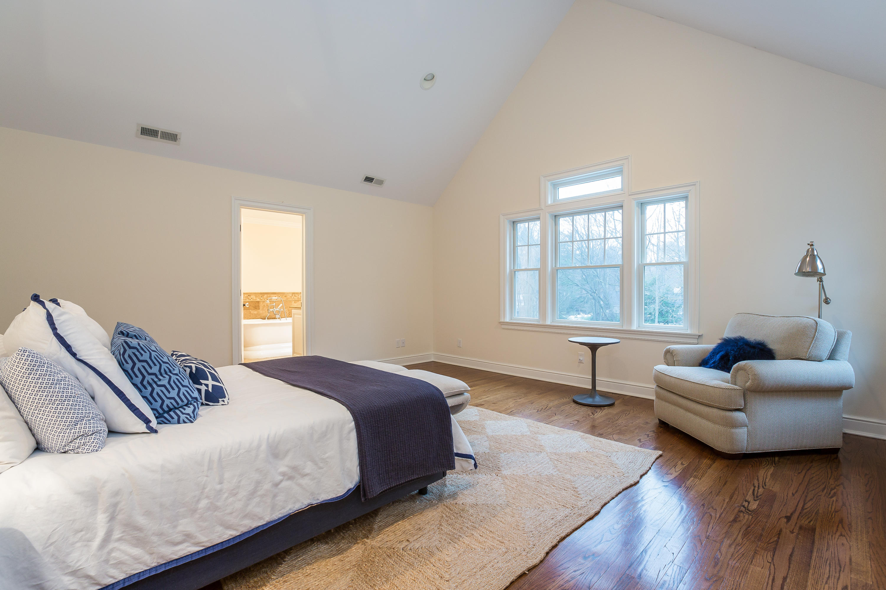 305 Middlesex Road Darien, CT 06820 - Photo 18 of 35 a bedroom with a bed and a couch with window