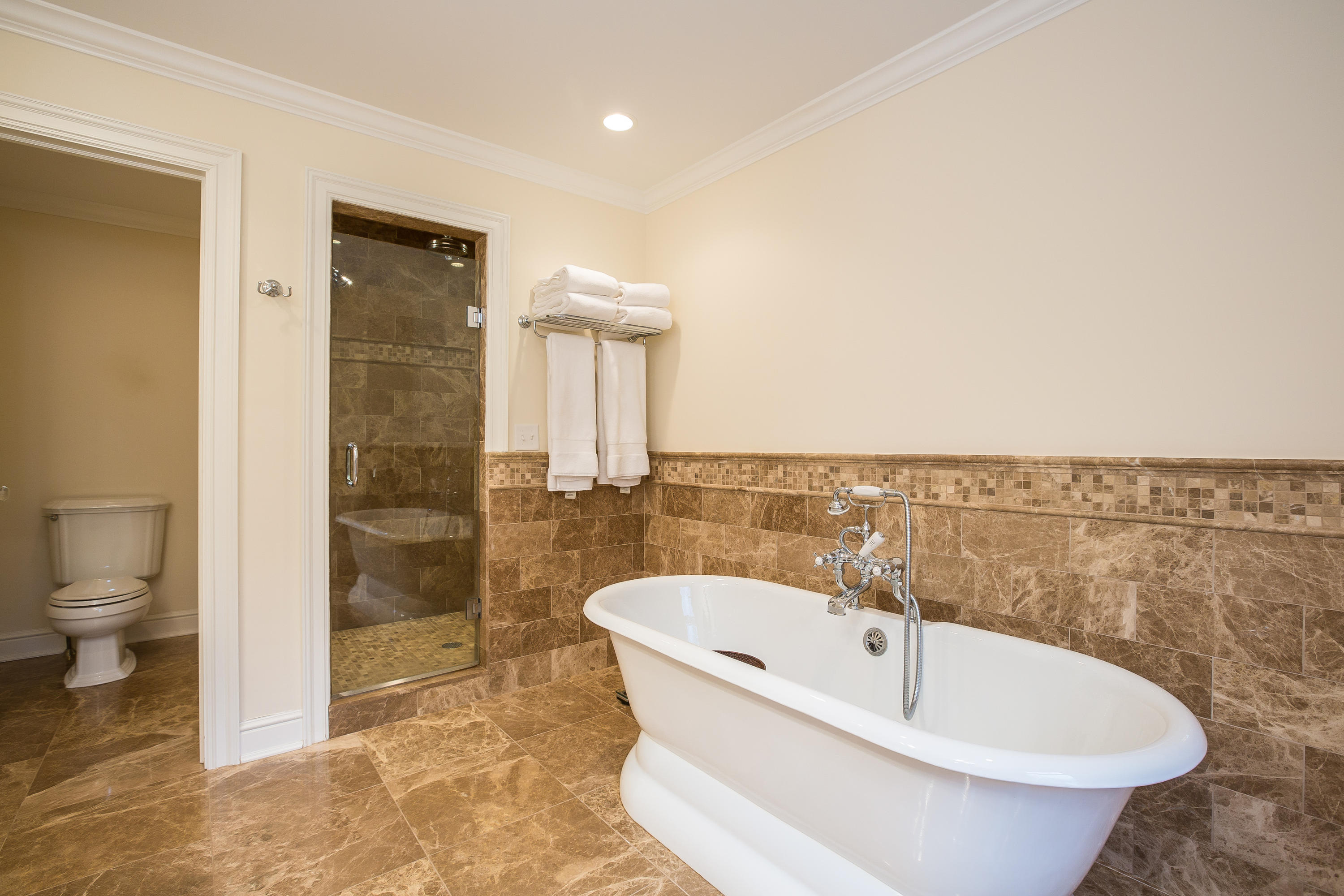 305 Middlesex Road Darien, CT 06820 - Photo 20 of 35 a white bath tub sitting next to a toilet