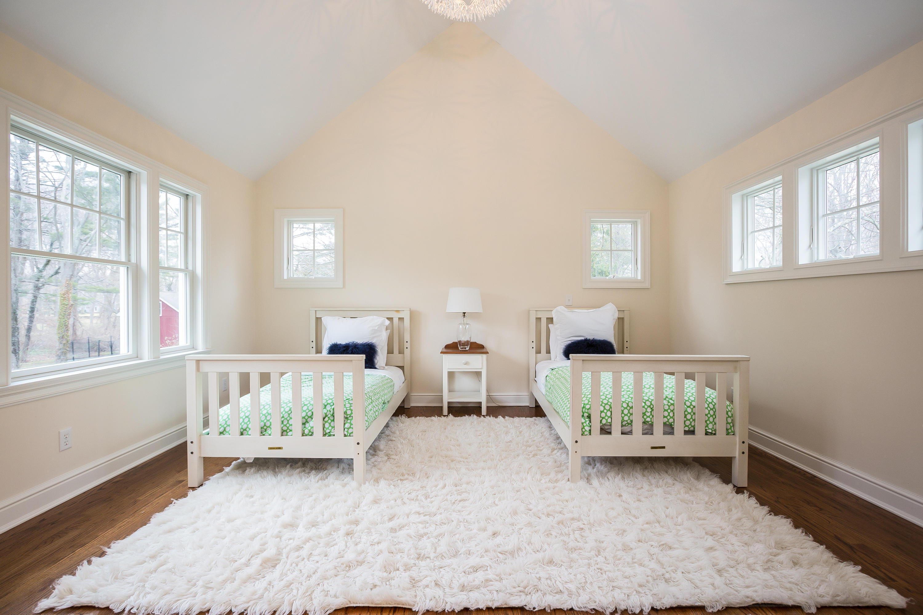 305 Middlesex Road Darien, CT 06820 - Photo 21 of 35 a bedroom with two beds and windows