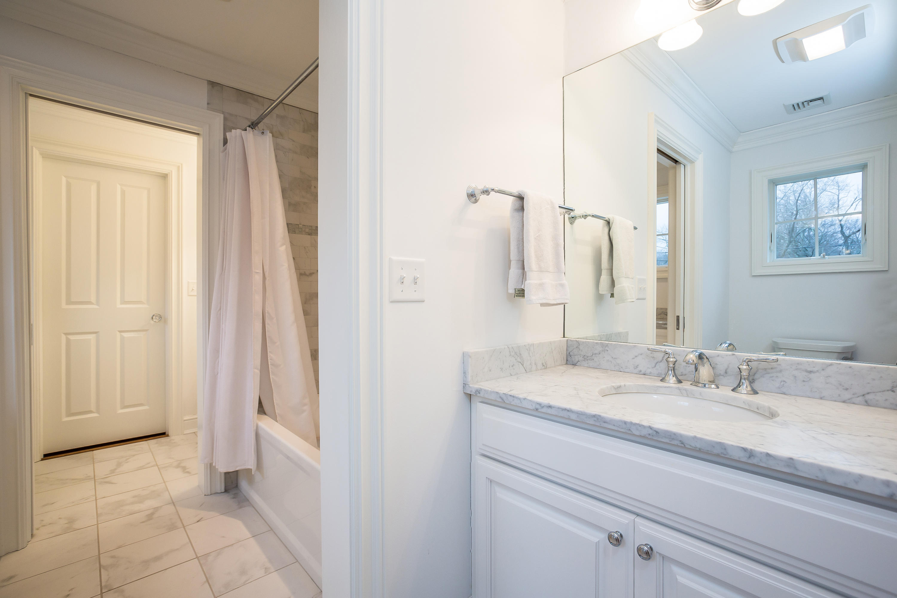 305 Middlesex Road Darien, CT 06820 - Photo 24 of 35 a bathroom with a sink a mirror and a shower