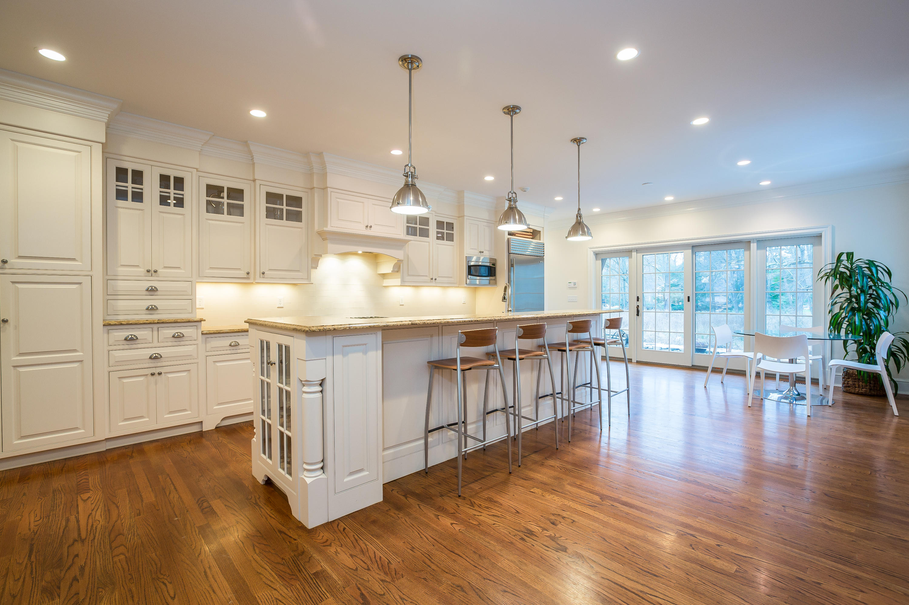305 Middlesex Road Darien, CT 06820 - Photo 3 of 35 a room with stainless steel appliances kitchen island granite countertop a stove a refrigerator a oven and a wooden cabinets with wooden floor