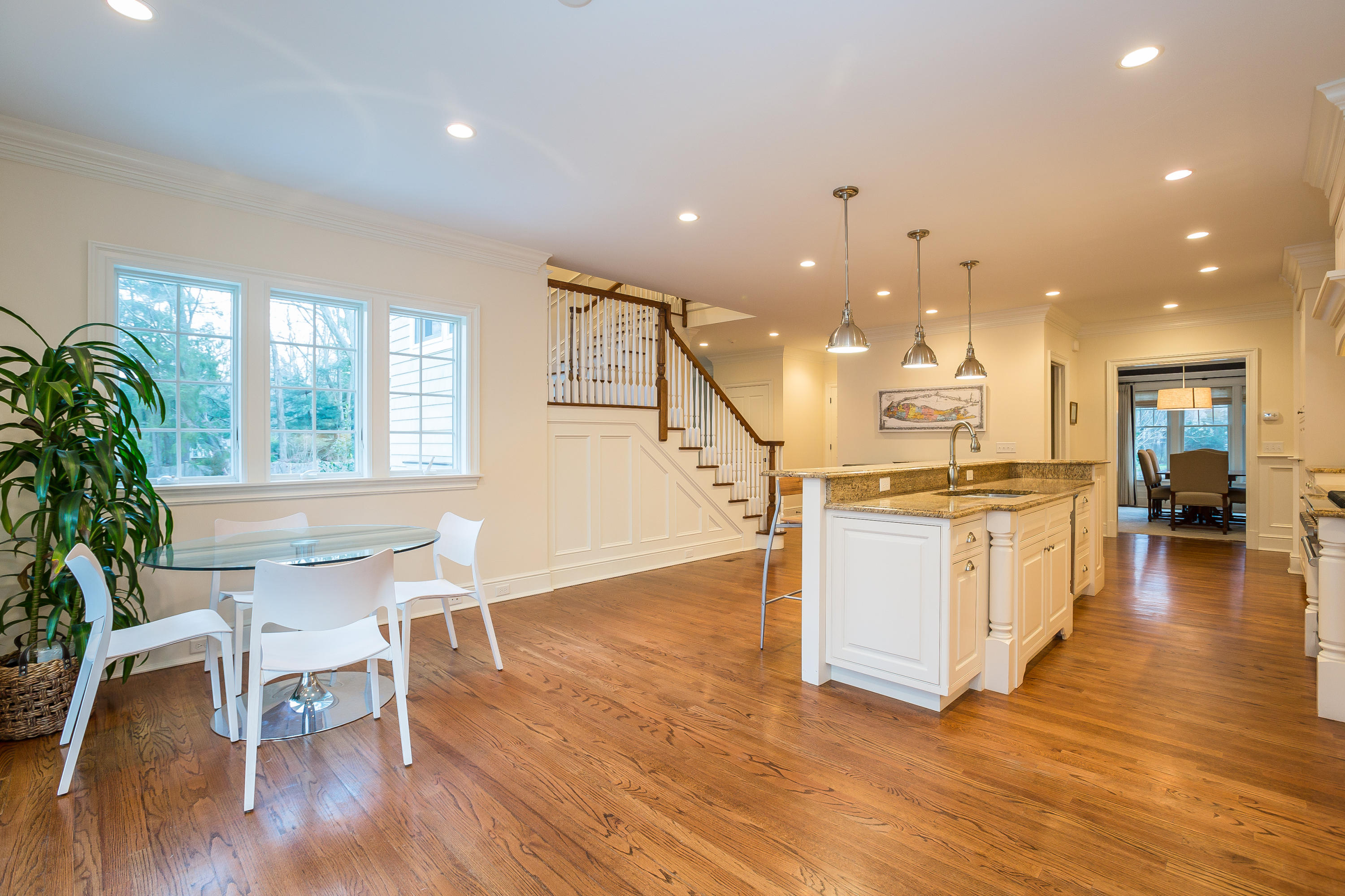 305 Middlesex Road Darien, CT 06820 - Photo 6 of 35 a open kitchen with white cabinets and wooden floor