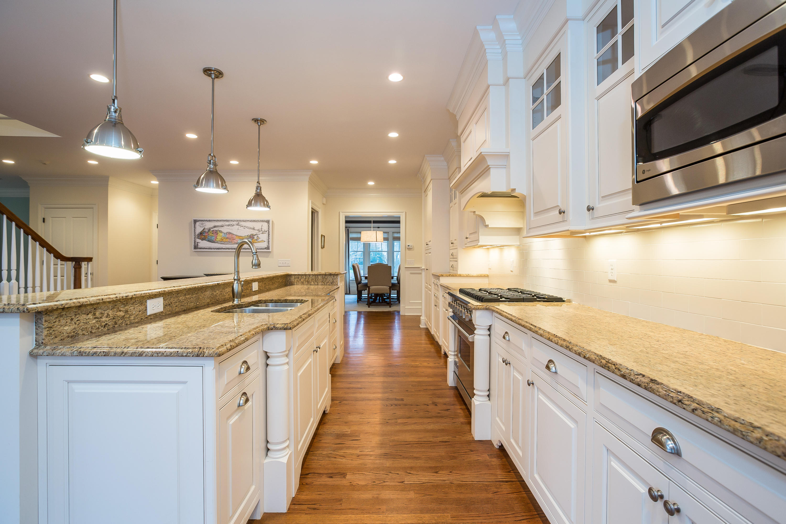 305 Middlesex Road Darien, CT 06820 - Photo 7 of 35 a large kitchen with stainless steel appliances lots of counter space and wooden floor