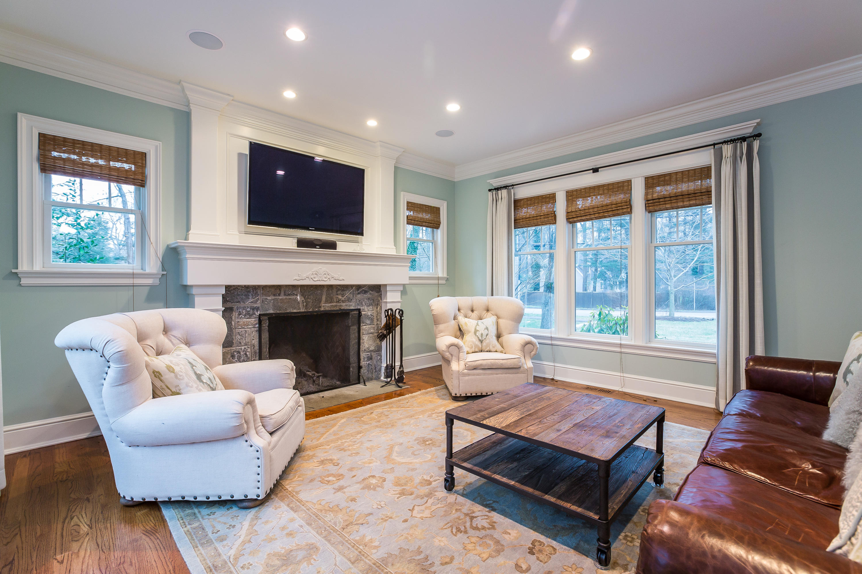 305 Middlesex Road Darien, CT 06820 - Photo 9 of 35 a living room with furniture fireplace and a flat screen tv