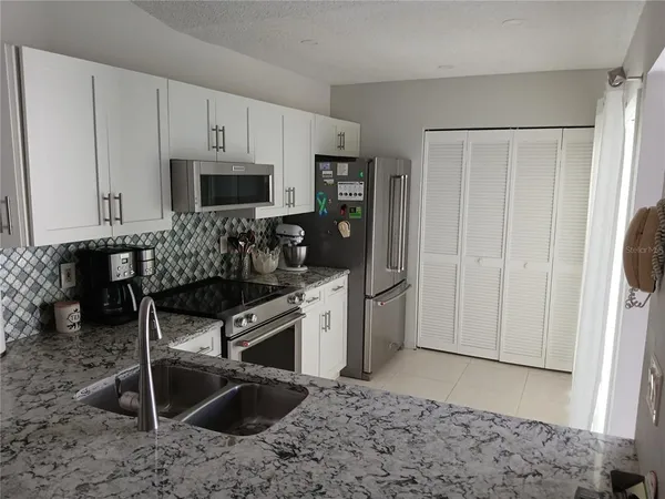 a kitchen with a stove and a microwave