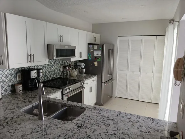 a kitchen with a stove and a microwave