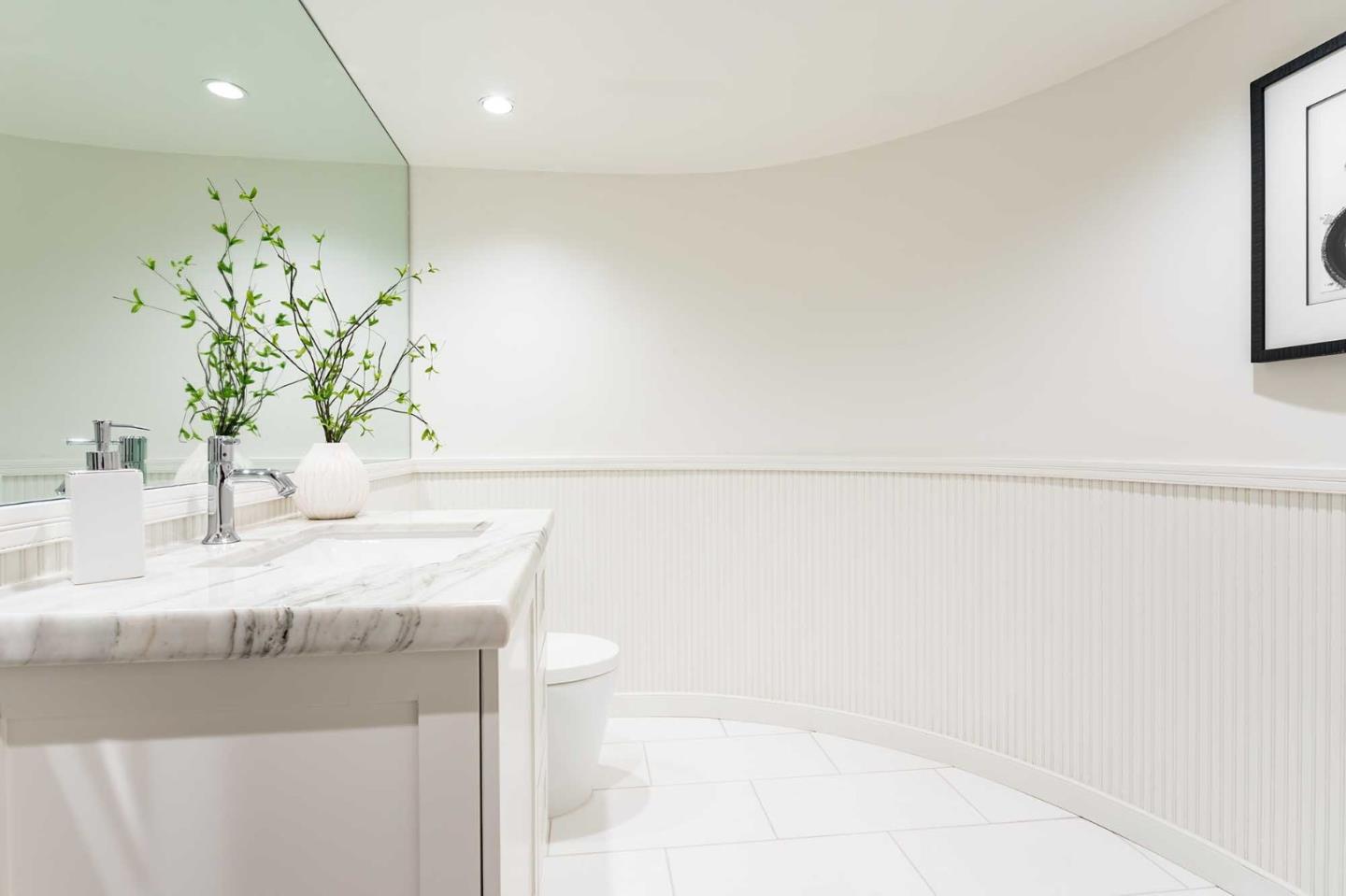 953 Roble Ridge Road Palo Alto, CA 94306 - Photo 21 of 50 a bathroom with a sink a mirror and a bathtub