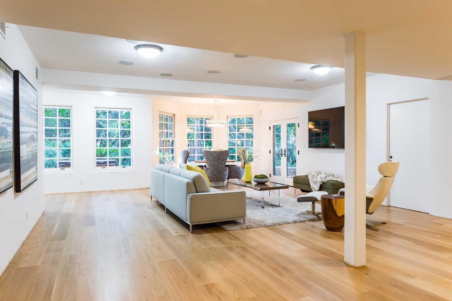 953 Roble Ridge Road Palo Alto, CA 94306 - Photo 22 of 50 a living room with furniture and a large window