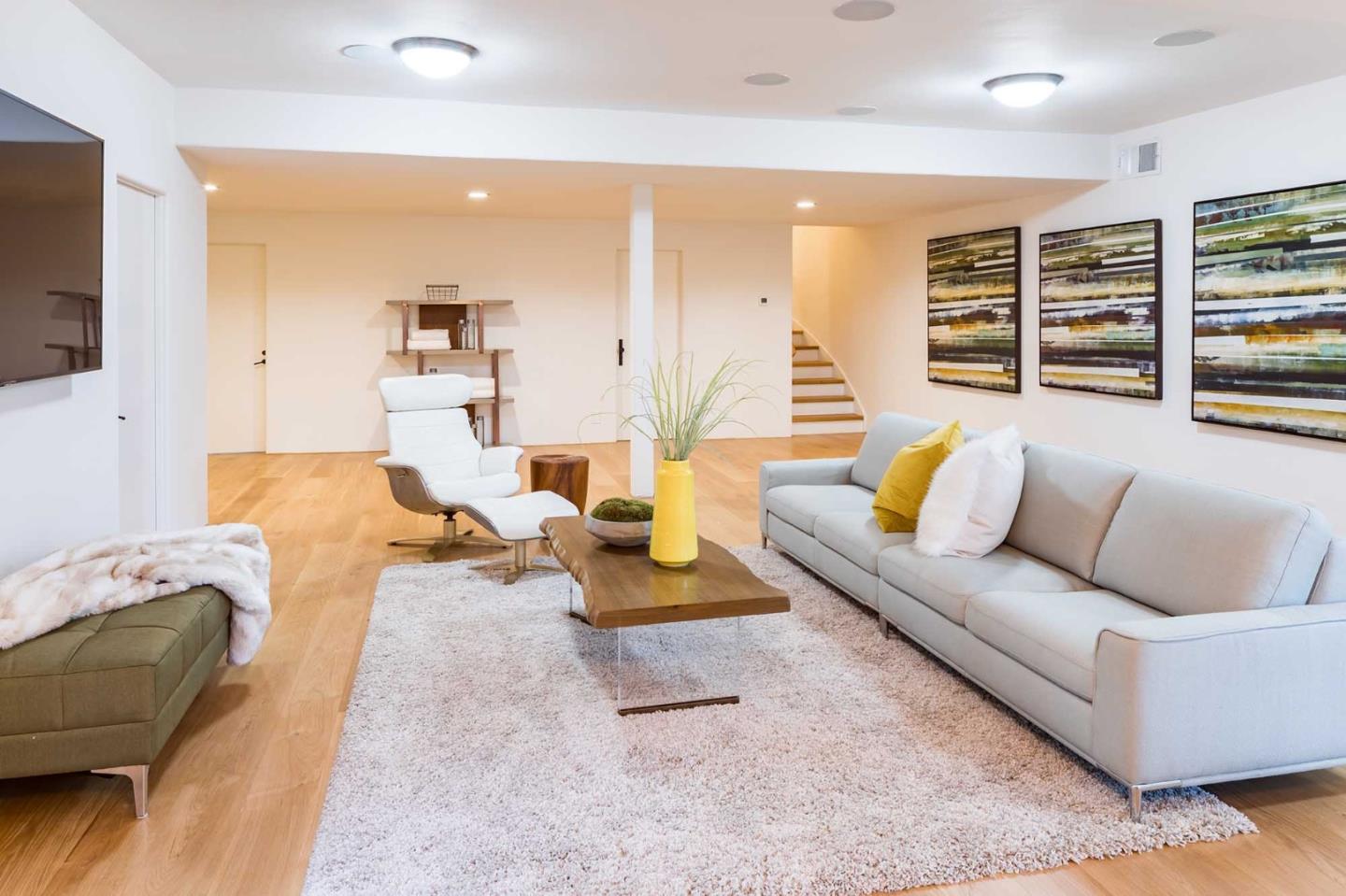953 Roble Ridge Road Palo Alto, CA 94306 - Photo 23 of 50 a living room with furniture and a flat screen tv
