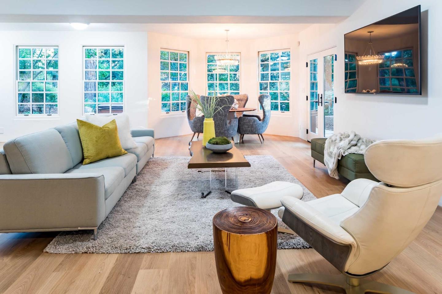 953 Roble Ridge Road Palo Alto, CA 94306 - Photo 24 of 50 a living room with furniture and a flat screen tv