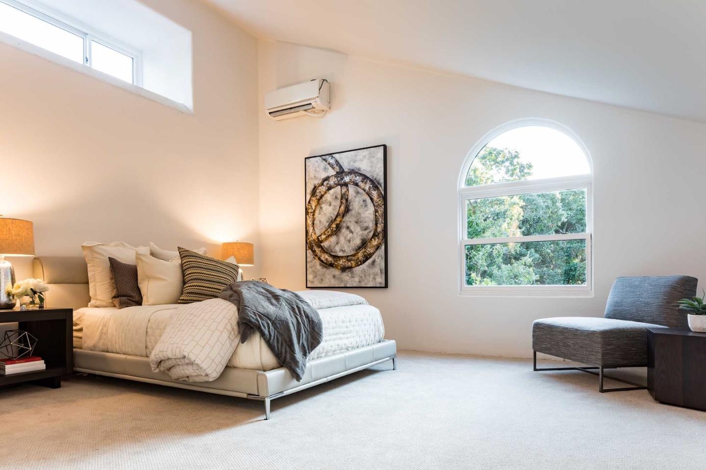 953 Roble Ridge Road Palo Alto, CA 94306 - Photo 28 of 50 a bedroom with bed and a window