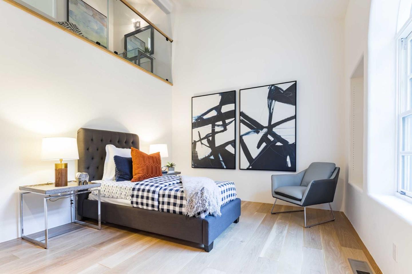 953 Roble Ridge Road Palo Alto, CA 94306 - Photo 32 of 50 a bedroom with a bed and chair