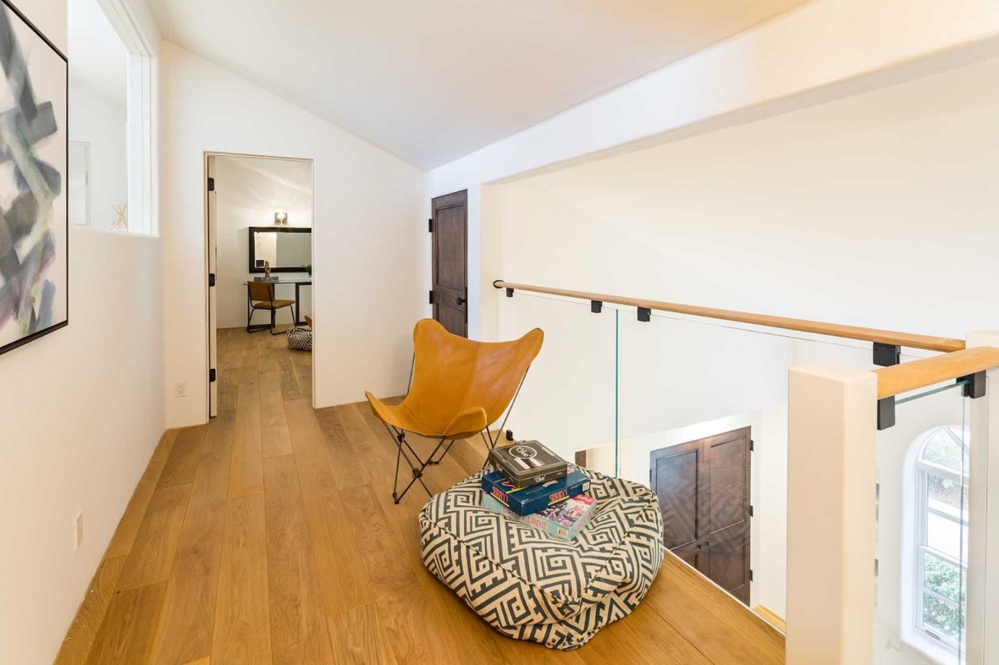 953 Roble Ridge Road Palo Alto, CA 94306 - Photo 34 of 50 a living room with furniture and a wooden floor