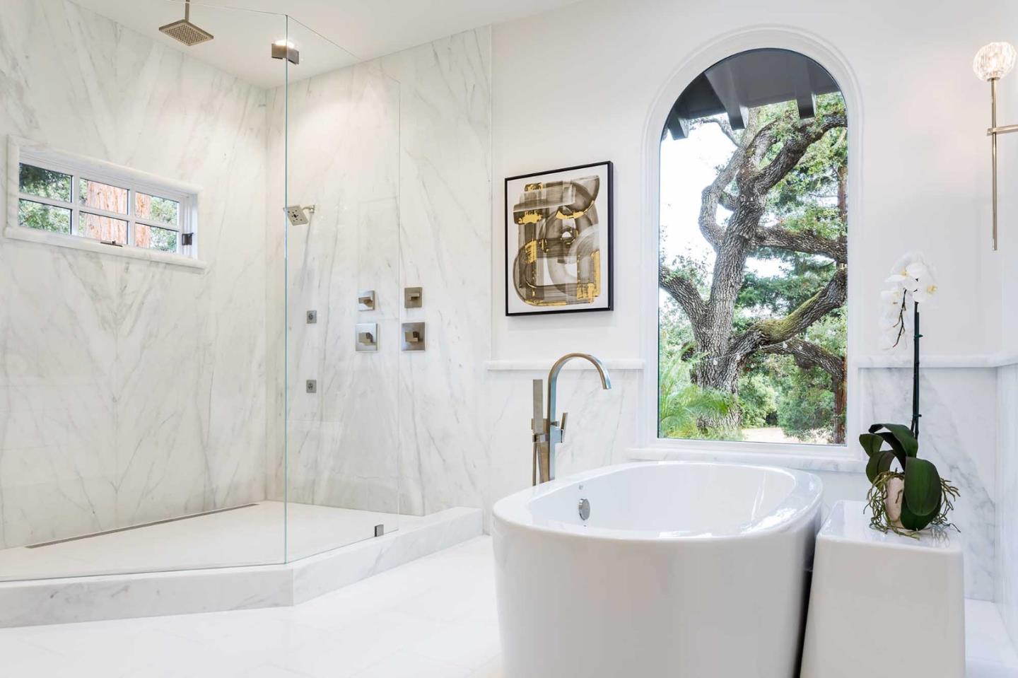 953 Roble Ridge Road Palo Alto, CA 94306 - Photo 42 of 50 a bath tub sitting next to a white sink