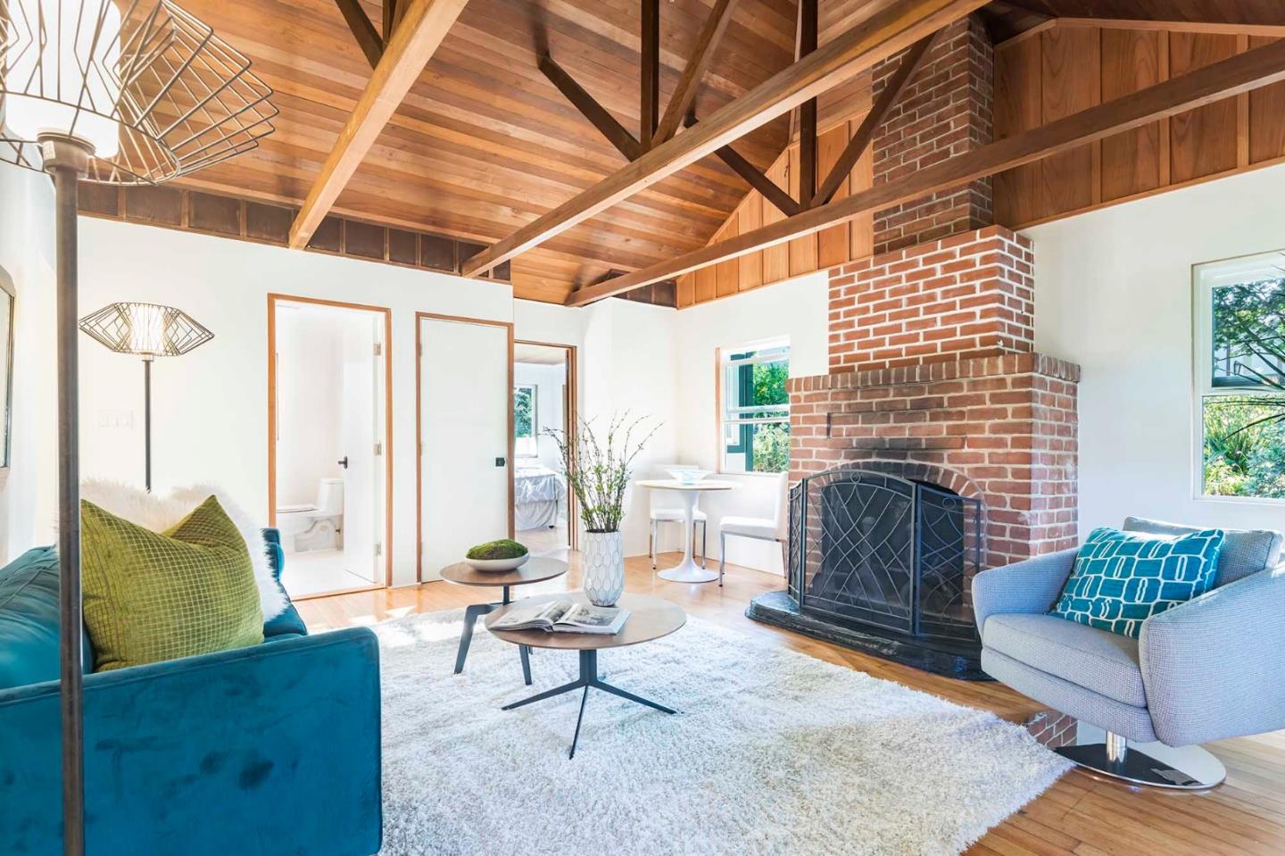 953 Roble Ridge Road Palo Alto, CA 94306 - Photo 49 of 50 a living room with furniture and a fireplace