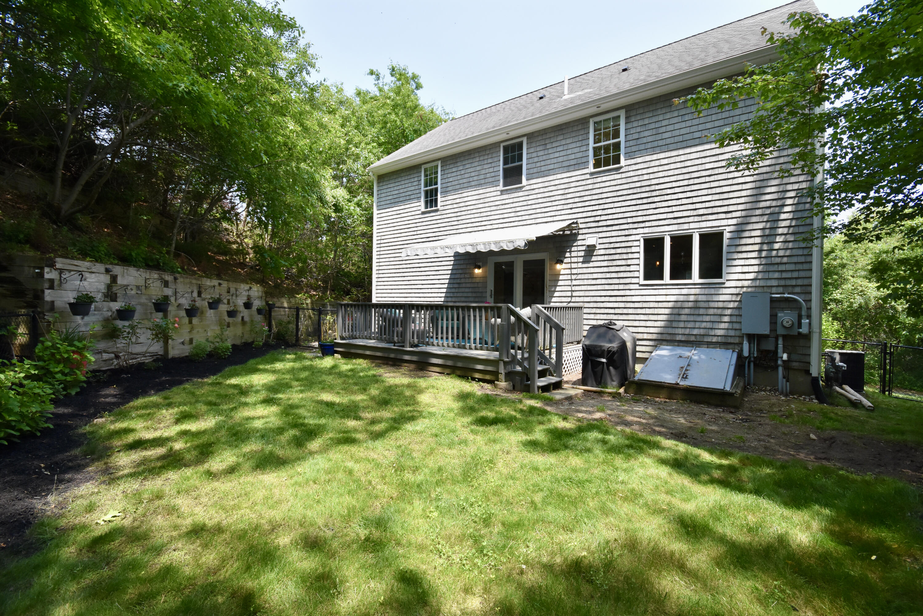 24 Sheppard Road Sagamore Beach, MA 02562 - Photo 36 of 41 a view of a house with backyard and sitting area
