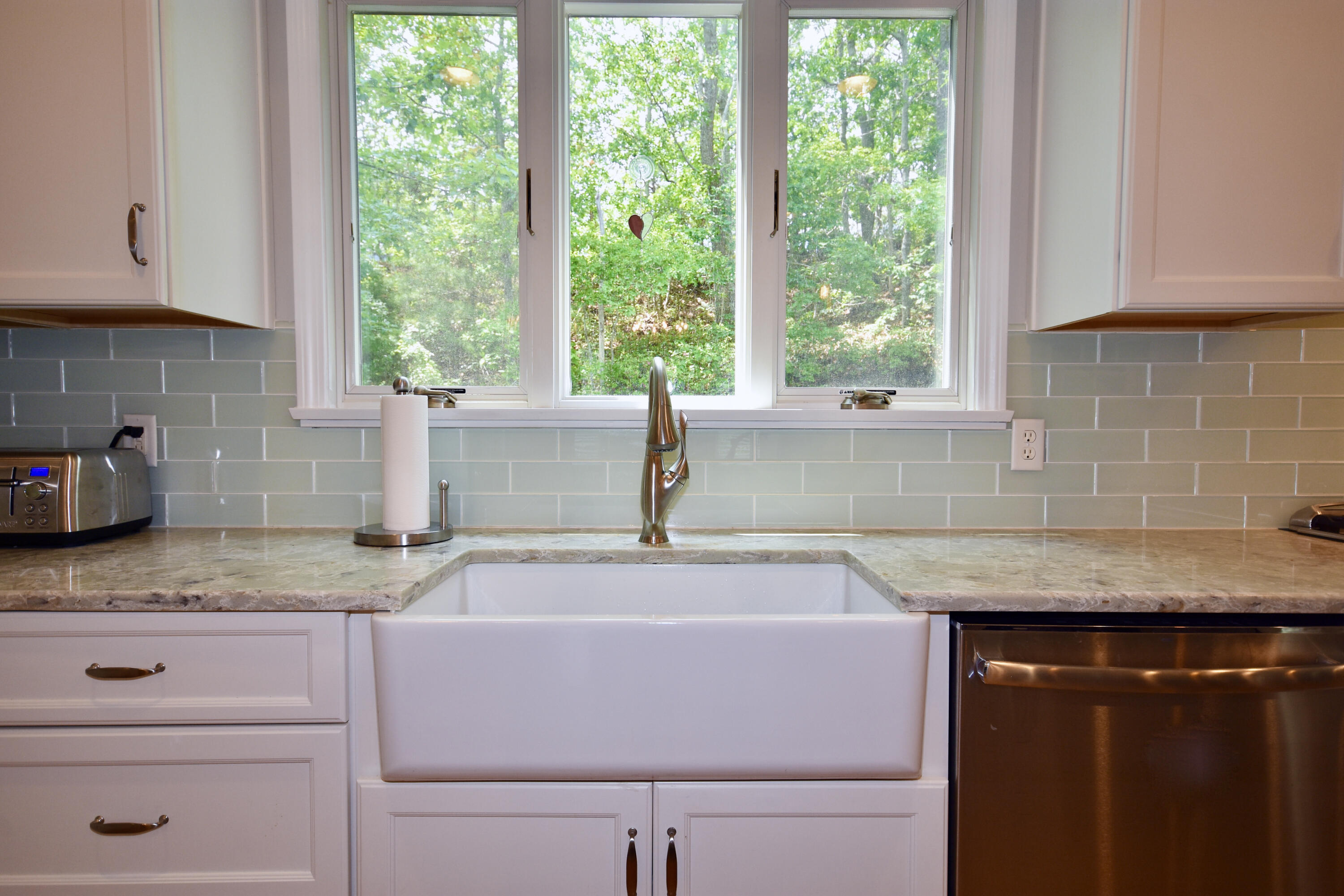 24 Sheppard Road Sagamore Beach, MA 02562 - Photo 10 of 41 a kitchen with granite countertop a sink window and cabinets