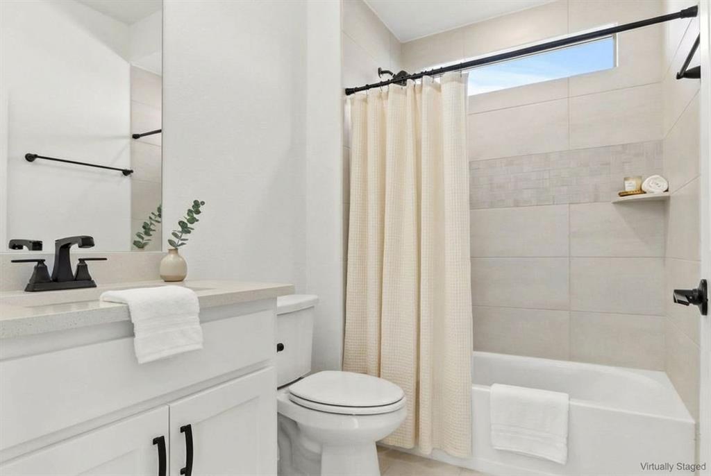 12831 Pne Rdg Trail Wylie, TX 75098 - Photo 8 of 12 a bathroom with a sink a toilet and shower