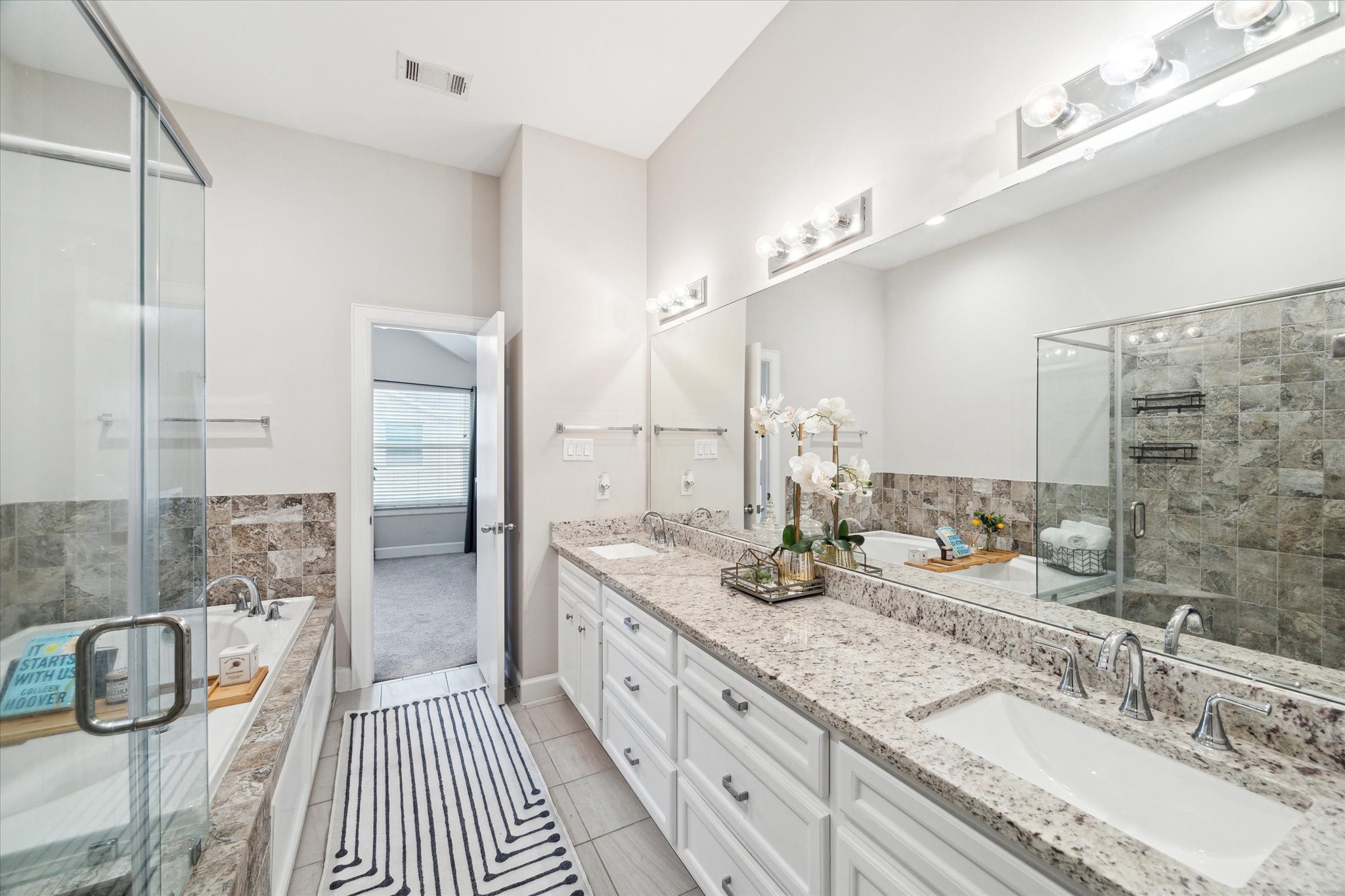 8705 Bryam Street, Unit 2003 Houston, TX 77061 - Photo 12 of 14 a bathroom with double vanity sink and a mirror