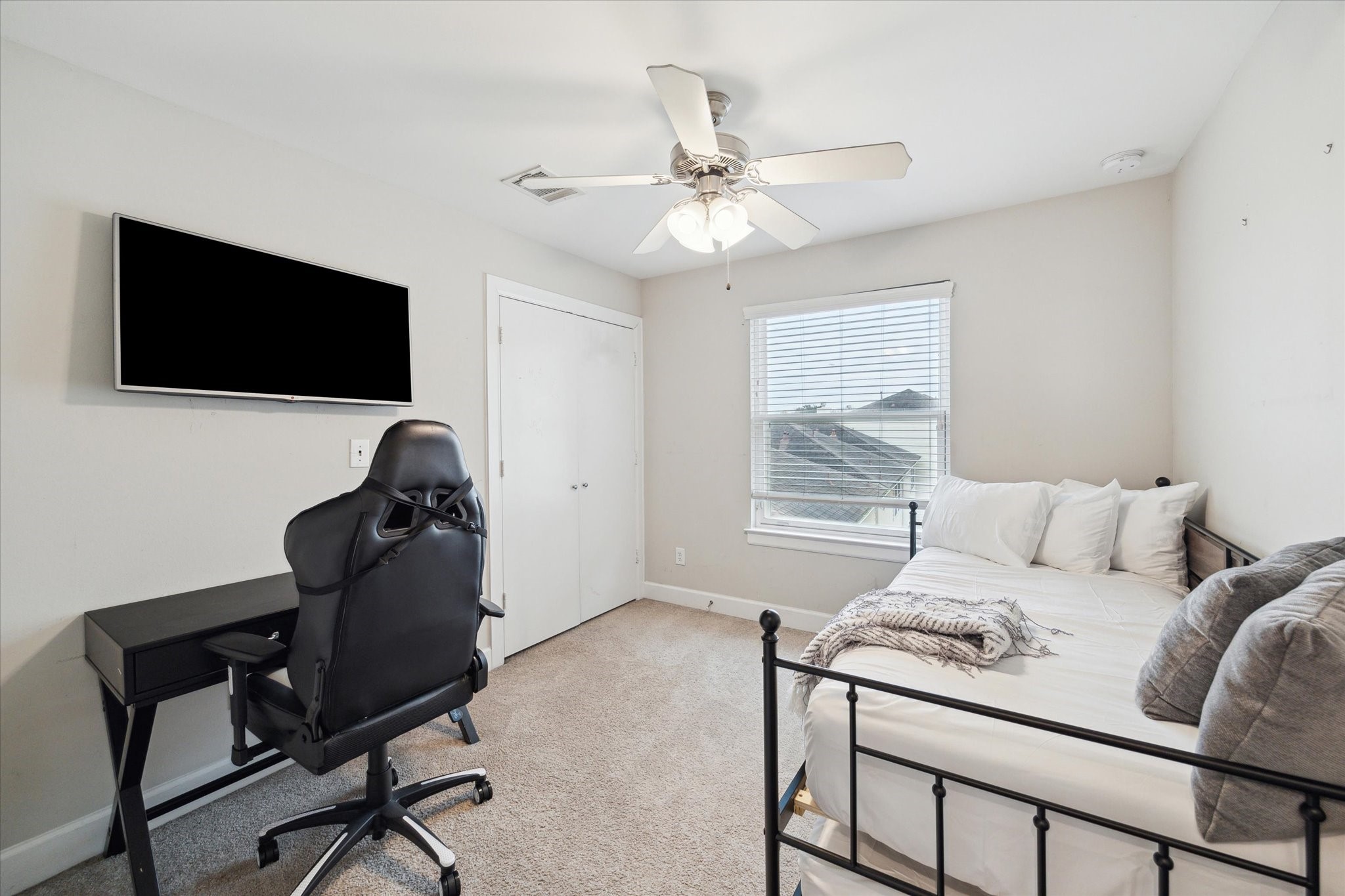 8705 Bryam Street, Unit 2003 Houston, TX 77061 - Photo 13 of 14 a living room with furniture and a flat screen tv