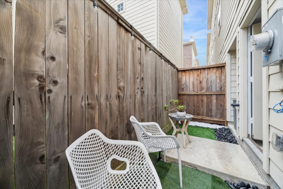 8705 Bryam Street, Unit 2003 Houston, TX 77061 - Photo 14 of 14 a view of balcony with two chairs and a rug