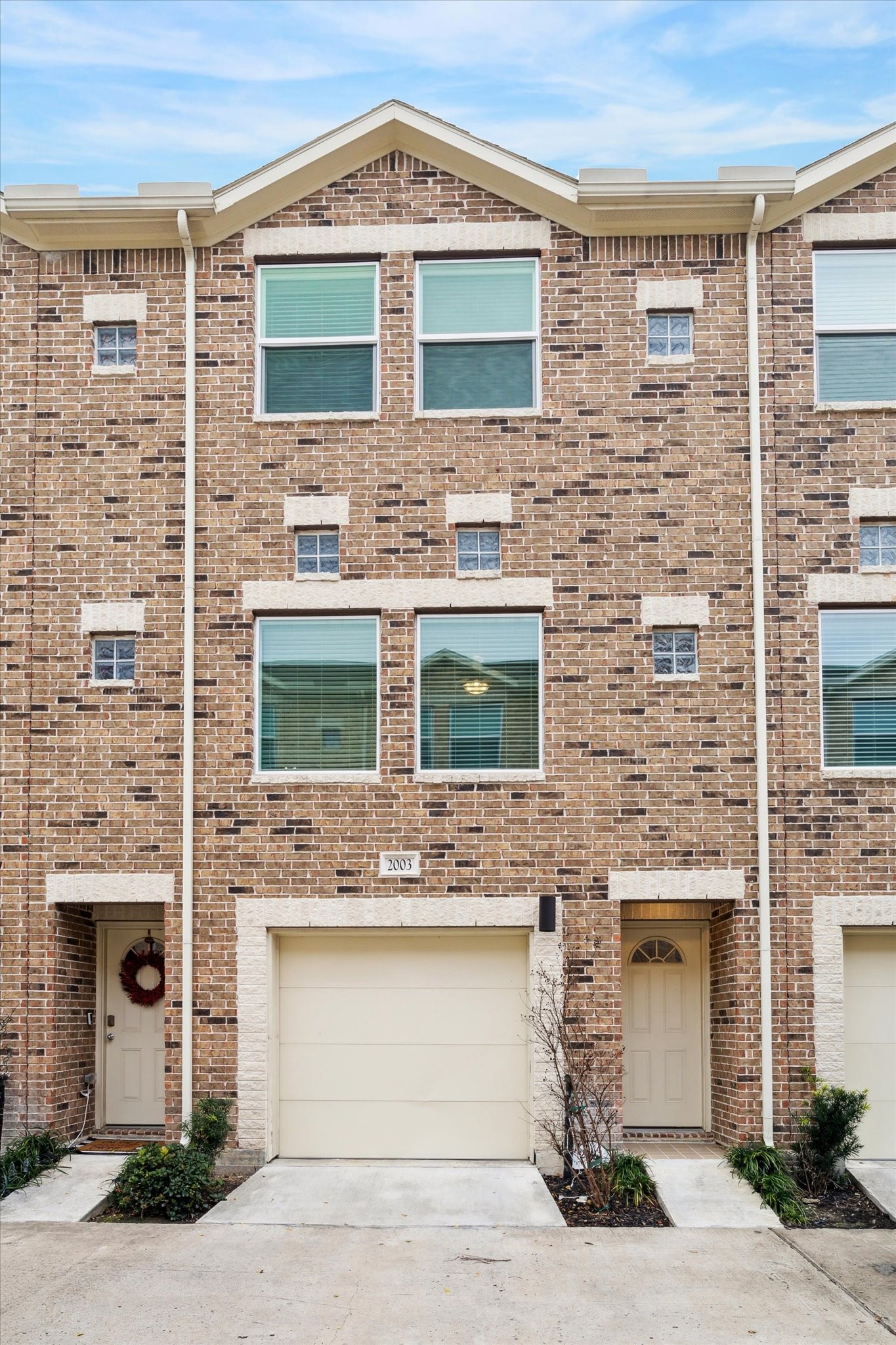 8705 Bryam Street, Unit 2003 Houston, TX 77061 - Photo 2 of 14 a front view of a house with a garage