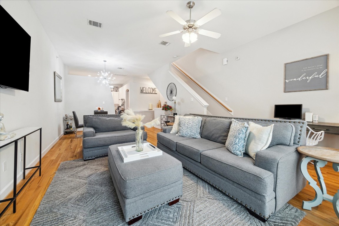 8705 Bryam Street, Unit 2003 Houston, TX 77061 - Photo 5 of 14 a living room with furniture a flat screen tv and a ceiling fan