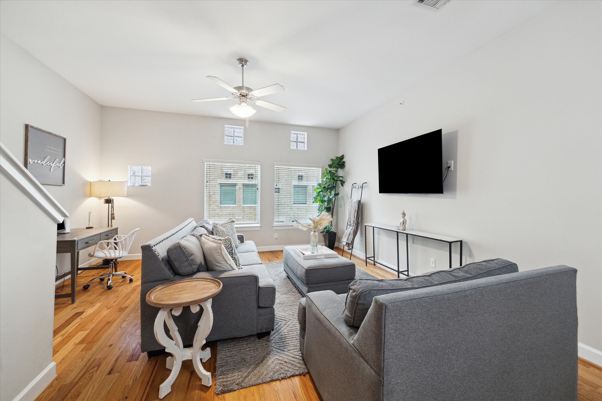 8705 Bryam Street, Unit 2003 Houston, TX 77061 - Photo 6 of 14 a living room with furniture and a flat screen tv