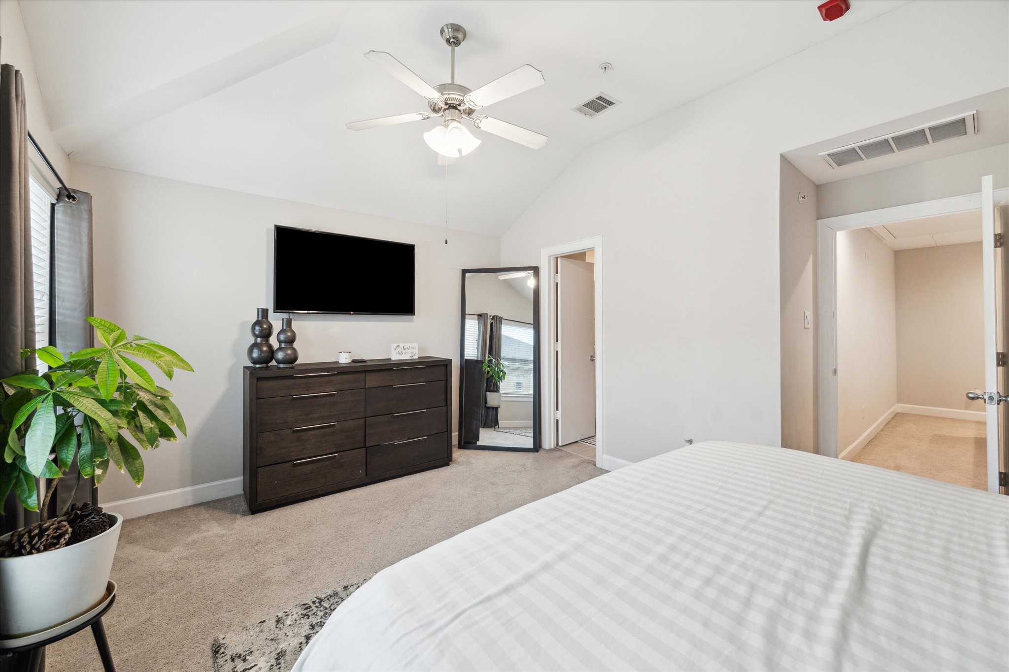 8705 Bryam Street, Unit 2003 Houston, TX 77061 - Photo 10 of 14 a bedroom with a bed and a flat screen tv