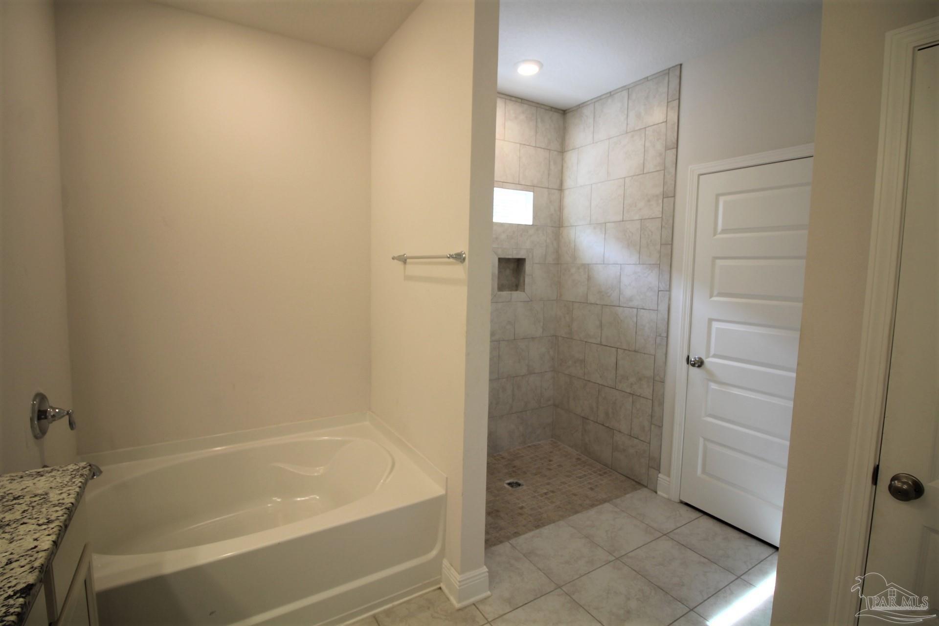 8006 Burnside Loop Pensacola, FL 32526 - Photo 14 of 22 a bathroom with a bathtub