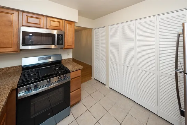 a kitchen with a stove and a microwave