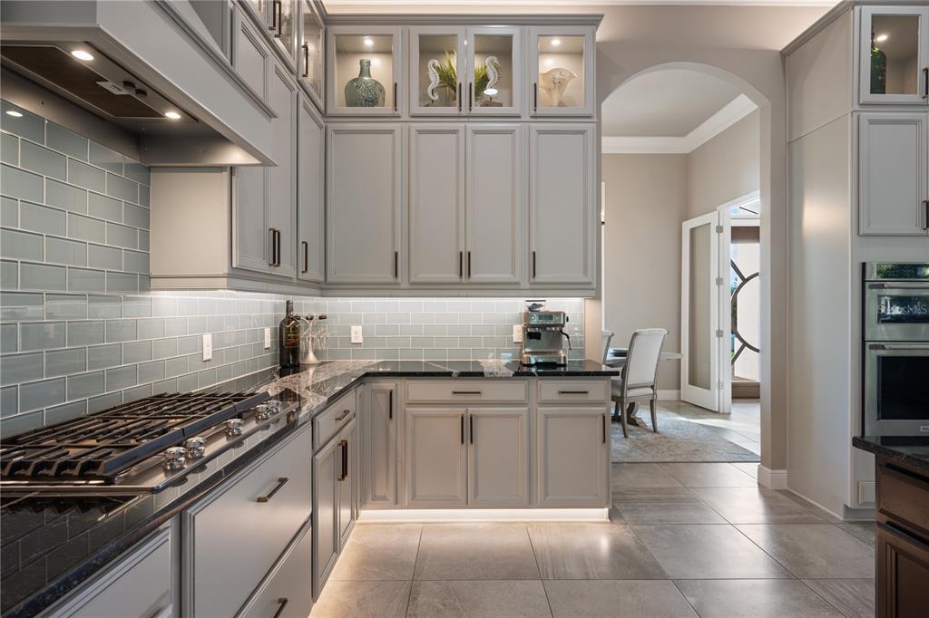 3738 Kissimmee Park Road St. Cloud, FL 34772 - Photo 24 of 62 a kitchen with stainless steel appliances granite countertop a stove a sink and a refrigerator