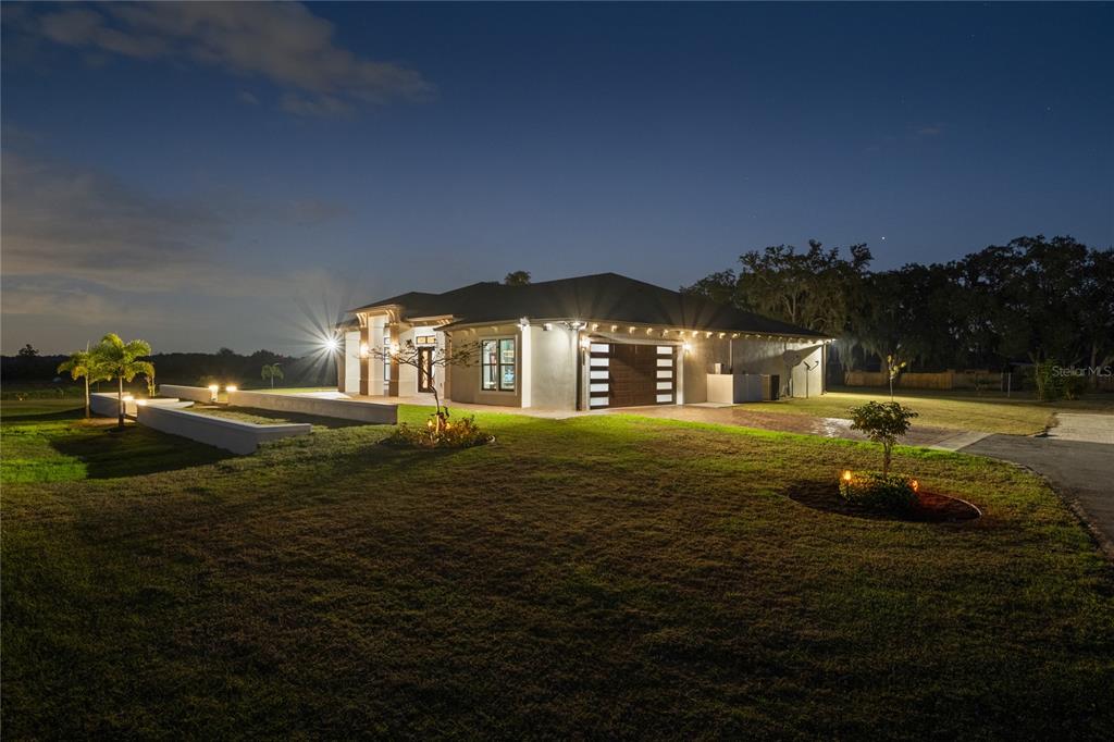 3738 Kissimmee Park Road St. Cloud, FL 34772 - Photo 4 of 62 a front view of a house with a garden