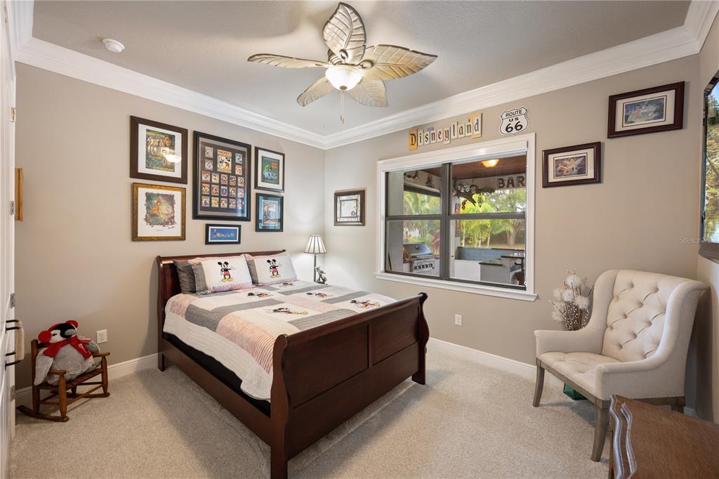 3738 Kissimmee Park Road St. Cloud, FL 34772 - Photo 41 of 62 a bedroom with a bed and a couch