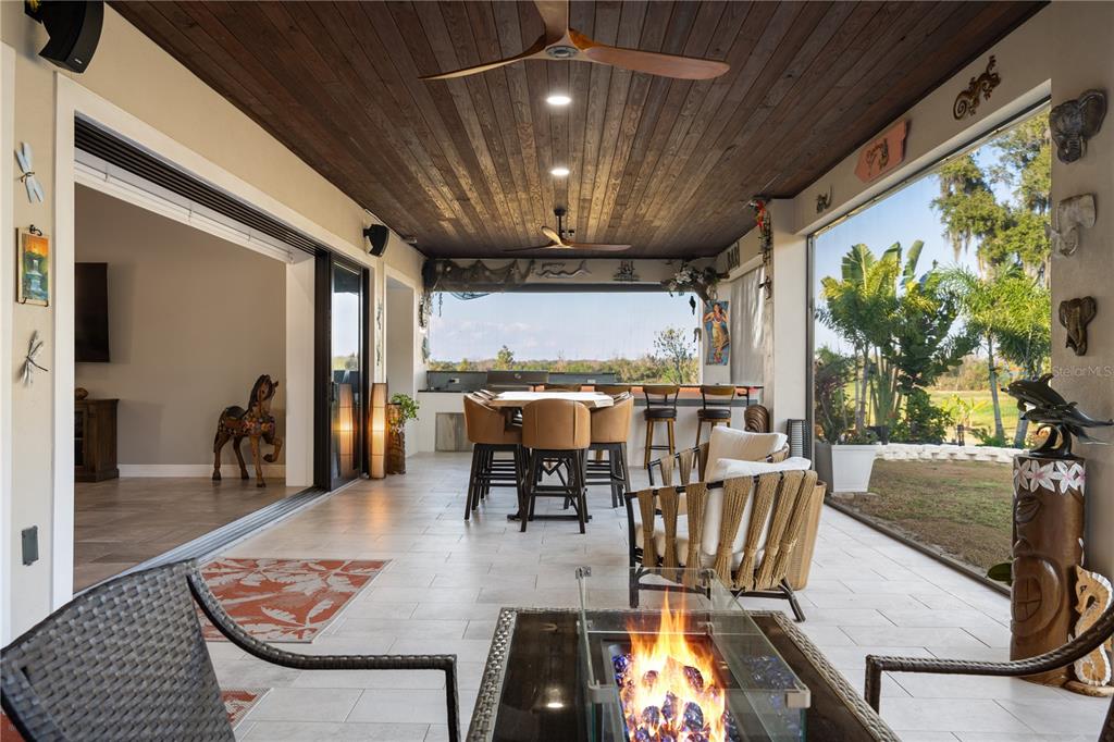 3738 Kissimmee Park Road St. Cloud, FL 34772 - Photo 43 of 62 a living room with furniture and a chandelier