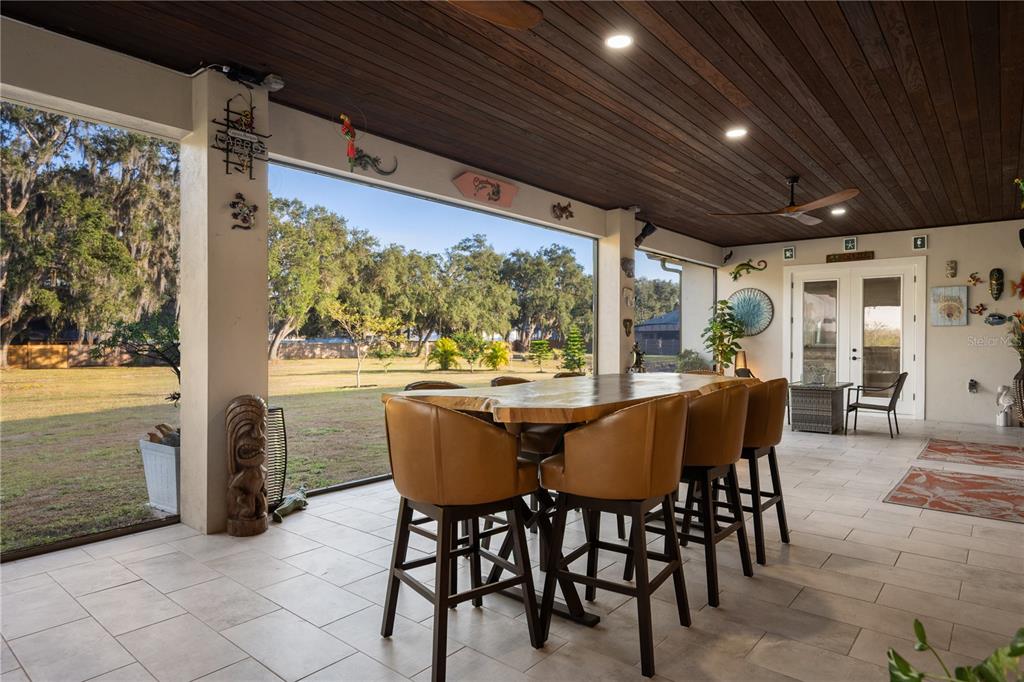 3738 Kissimmee Park Road St. Cloud, FL 34772 - Photo 47 of 62 a view of an outside dining space with furniture window and outside view