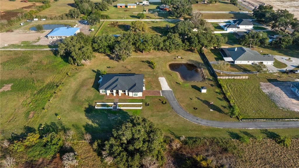 3738 Kissimmee Park Road St. Cloud, FL 34772 - Photo 50 of 62 an aerial view of a house with a yard