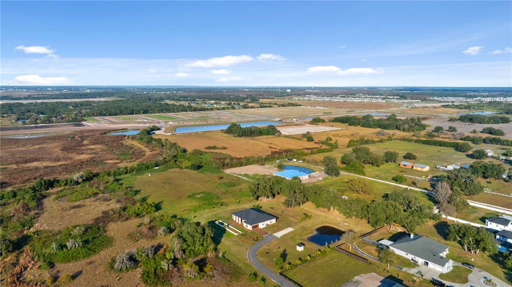 3738 Kissimmee Park Road St. Cloud, FL 34772 - Photo 52 of 62 an aerial view of residential building with outdoor space