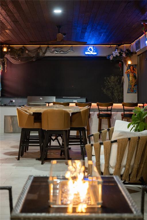 3738 Kissimmee Park Road St. Cloud, FL 34772 - Photo 58 of 62 a view of a patio with table and chairs