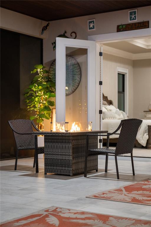 3738 Kissimmee Park Road St. Cloud, FL 34772 - Photo 59 of 62 a view of a chairs and table in a patio