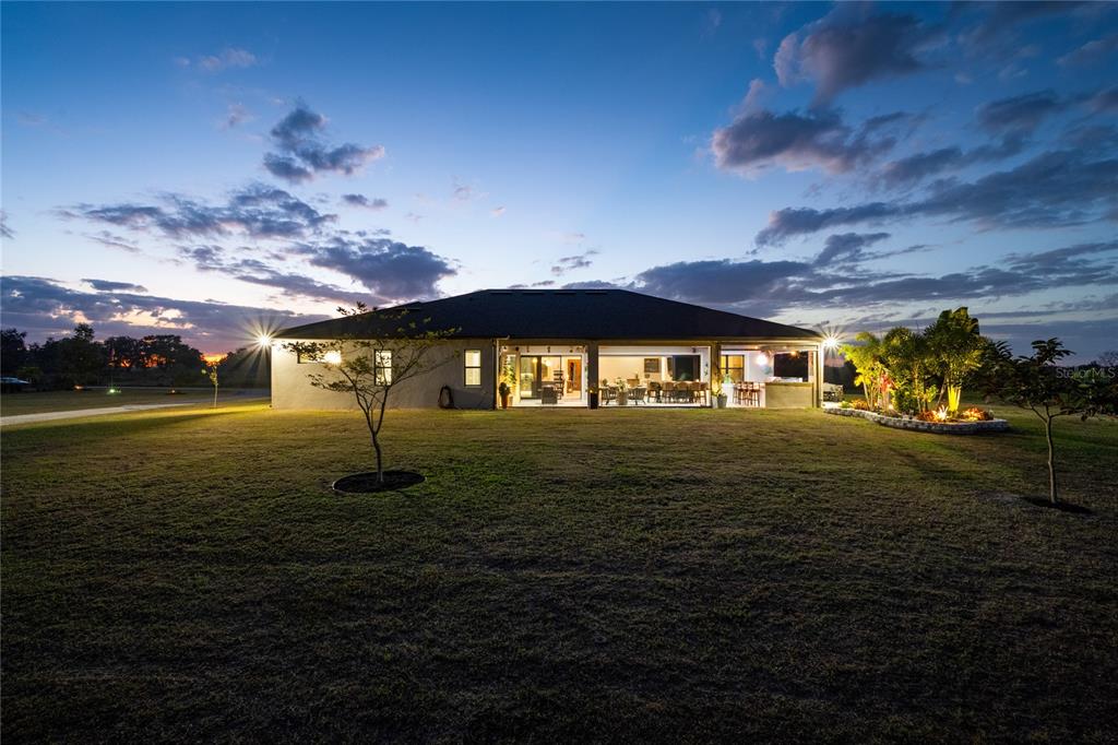 3738 Kissimmee Park Road St. Cloud, FL 34772 - Photo 60 of 62 a front view of a house with a yard