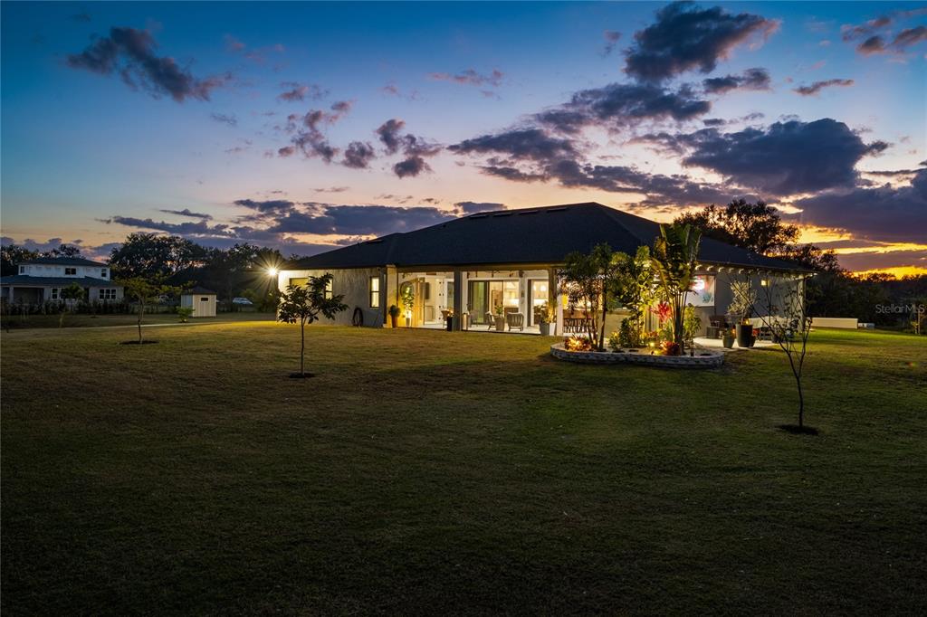 3738 Kissimmee Park Road St. Cloud, FL 34772 - Photo 61 of 62 a front view of a house with garden