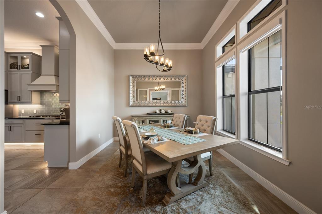 3738 Kissimmee Park Road St. Cloud, FL 34772 - Photo 8 of 62 a view of a dining room with furniture window and wooden floor