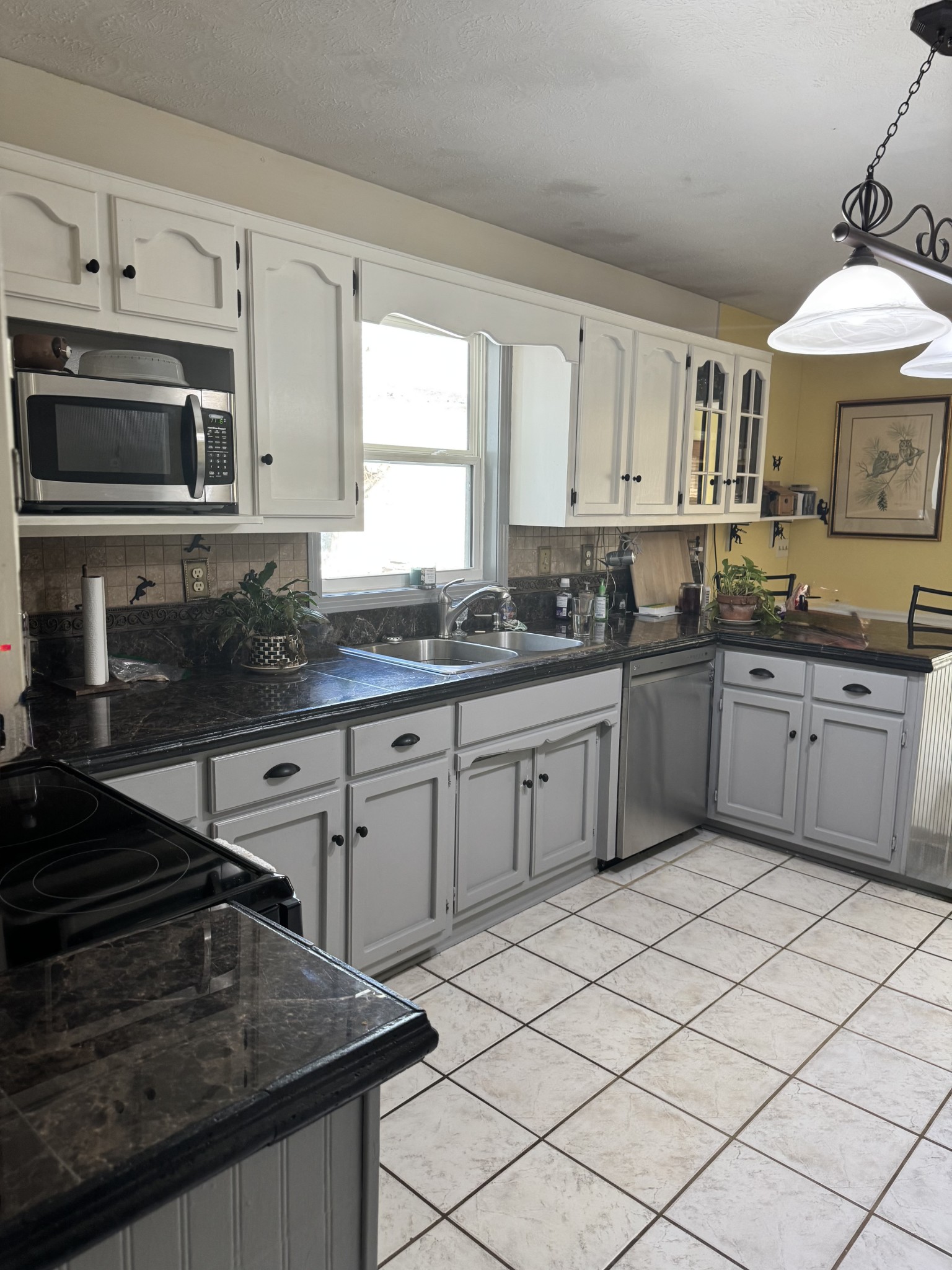 267 Difficult Road Pleasant Shade, TN 37145 - Photo 15 of 20 a kitchen with stainless steel appliances granite countertop a sink stove and cabinets