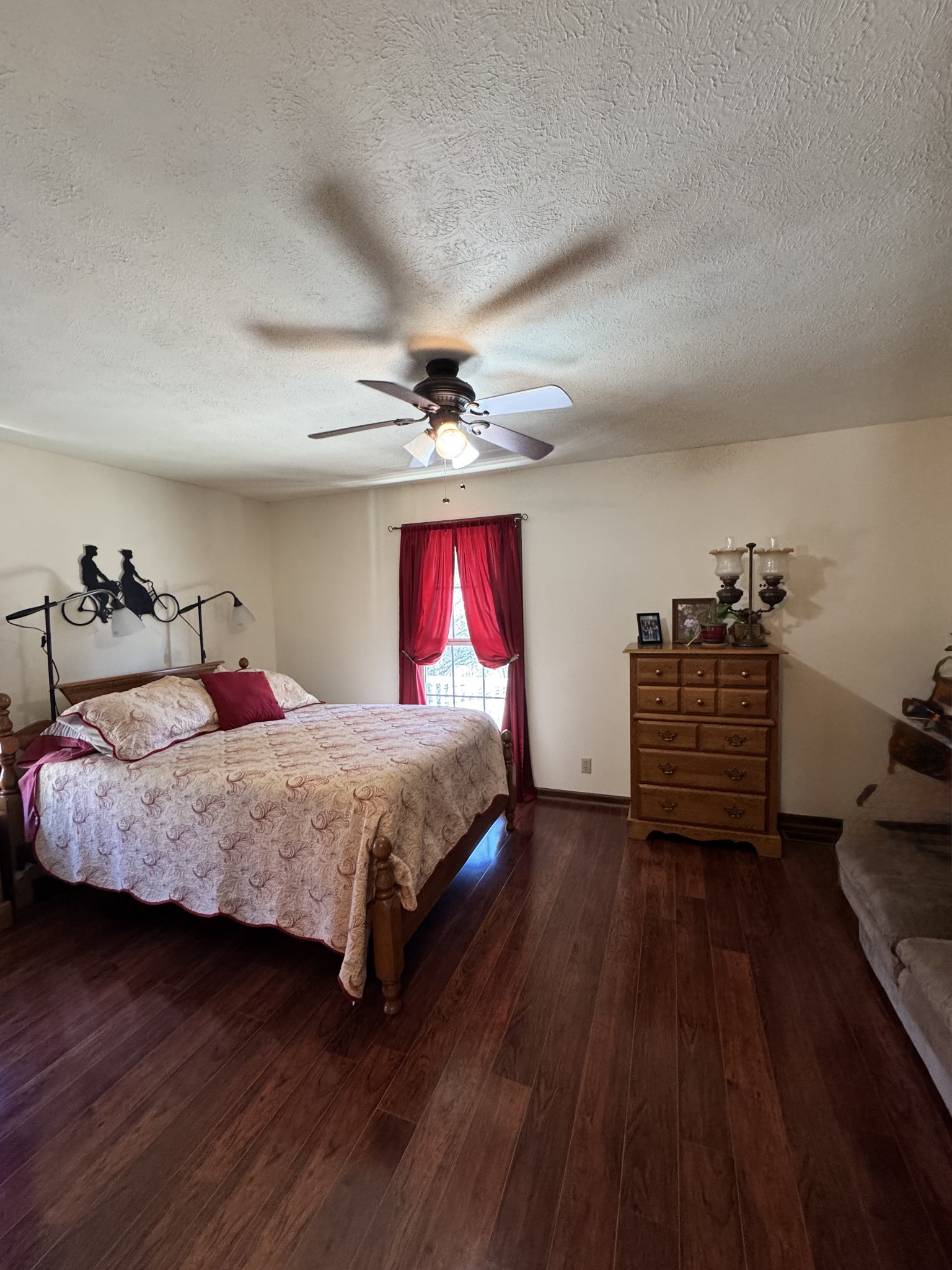 267 Difficult Road Pleasant Shade, TN 37145 - Photo 17 of 20 a spacious bedroom with a bed and wooden floor