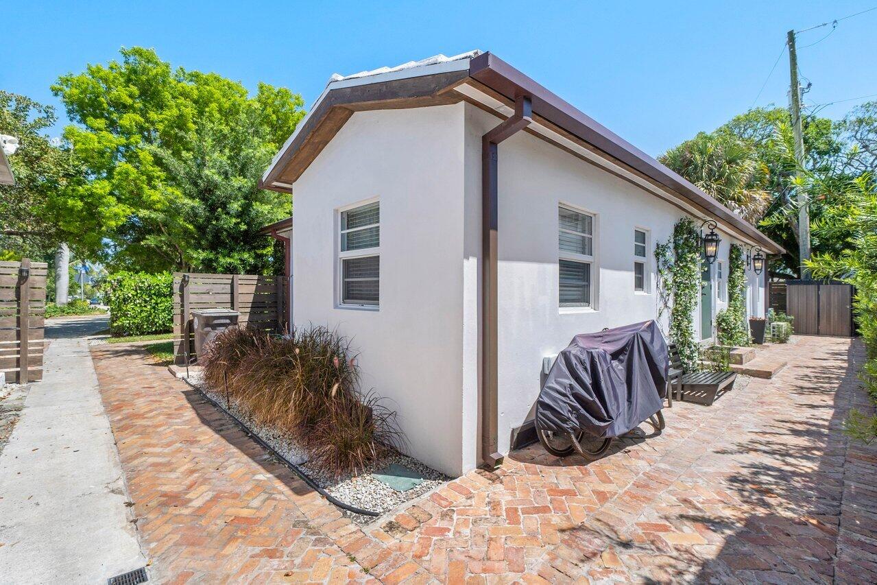 706 Sunset Road, Unit C West Palm Beach, FL 33401 - Photo 14 of 15 a view of a backyard with a patio